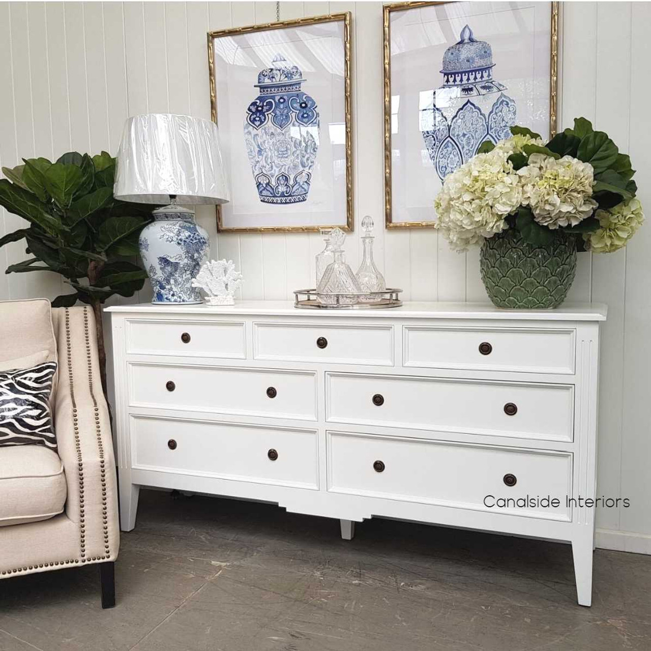 The sideboard styled within a coastal-themed bedroom, offering a serene and sophisticated storage solution.