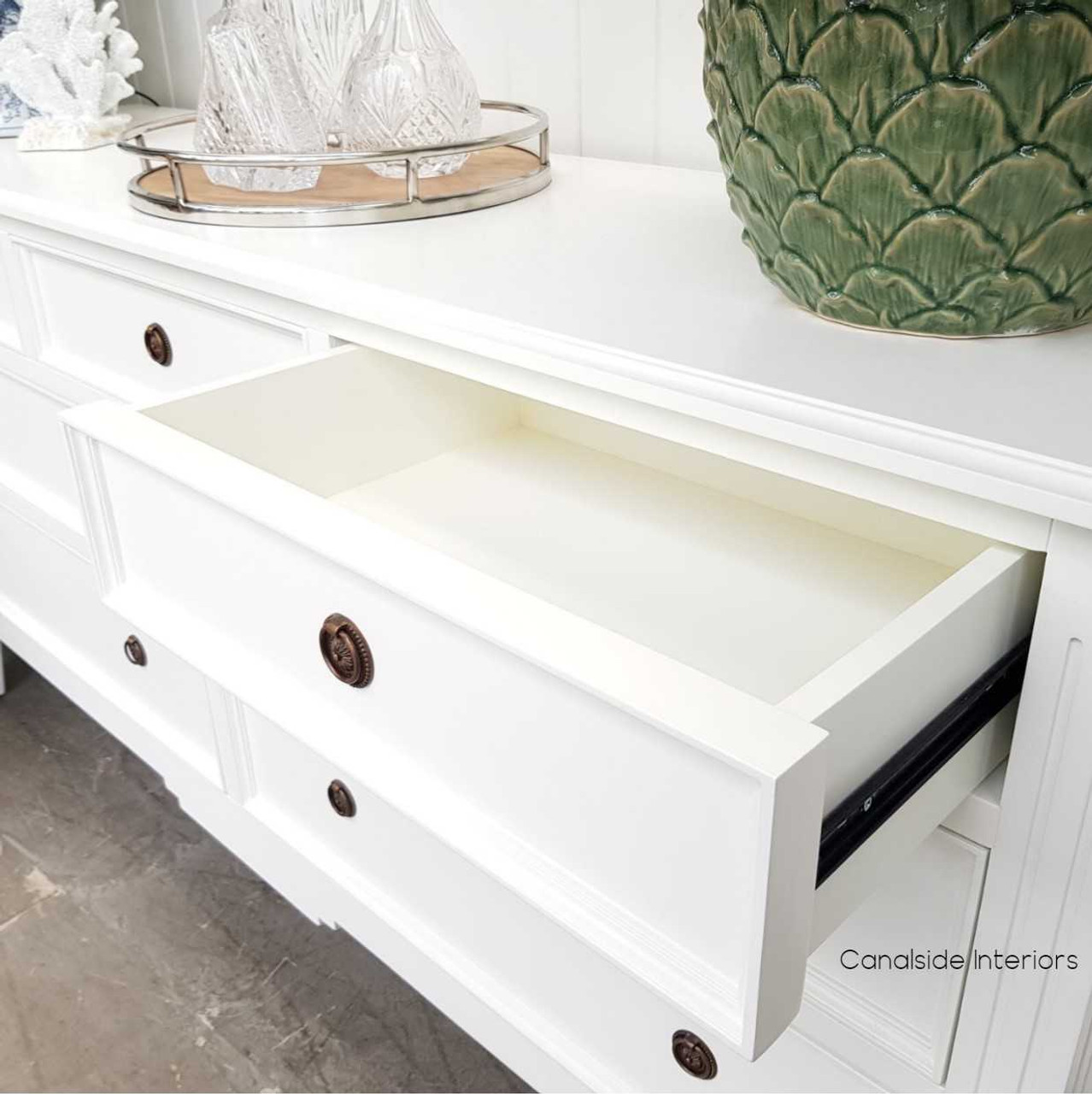 Detail of the smooth metal runners, ensuring functionality meets style with the sideboard's easy-to-use drawers.