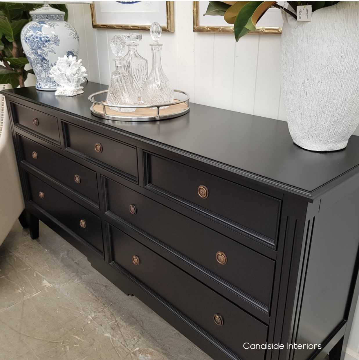 Close-up of the sideboard's minor distressing, highlighting the detailed craftsmanship and timeless style.