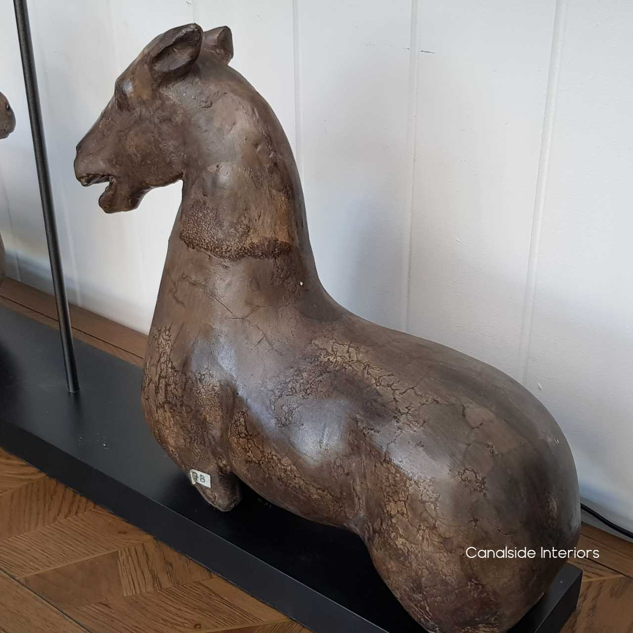 Detail shot of the Ancient Equestrian Lamp, showcasing the quality craftsmanship and unique texture beneath the white lampshade.