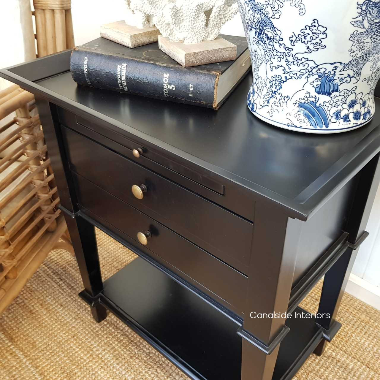 Angled view demonstrating the practical pull-out tray, perfect for extending storage or display space.