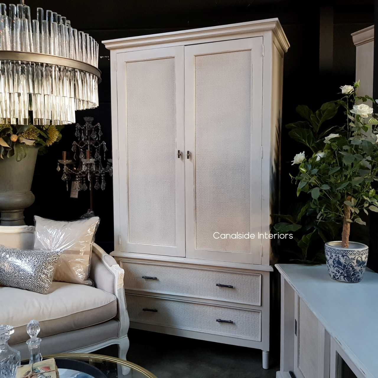 Set in a living room, the wardrobe serves as a stylish storage solution, proving its versatility beyond the bedroom.