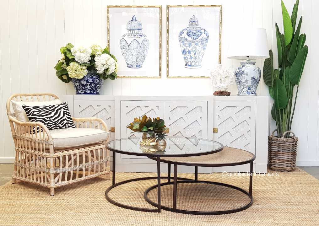 Canalside Interiors' Knox Tables, with their distressed brass frames, provide an elegant yet functional centerpiece for modern living rooms