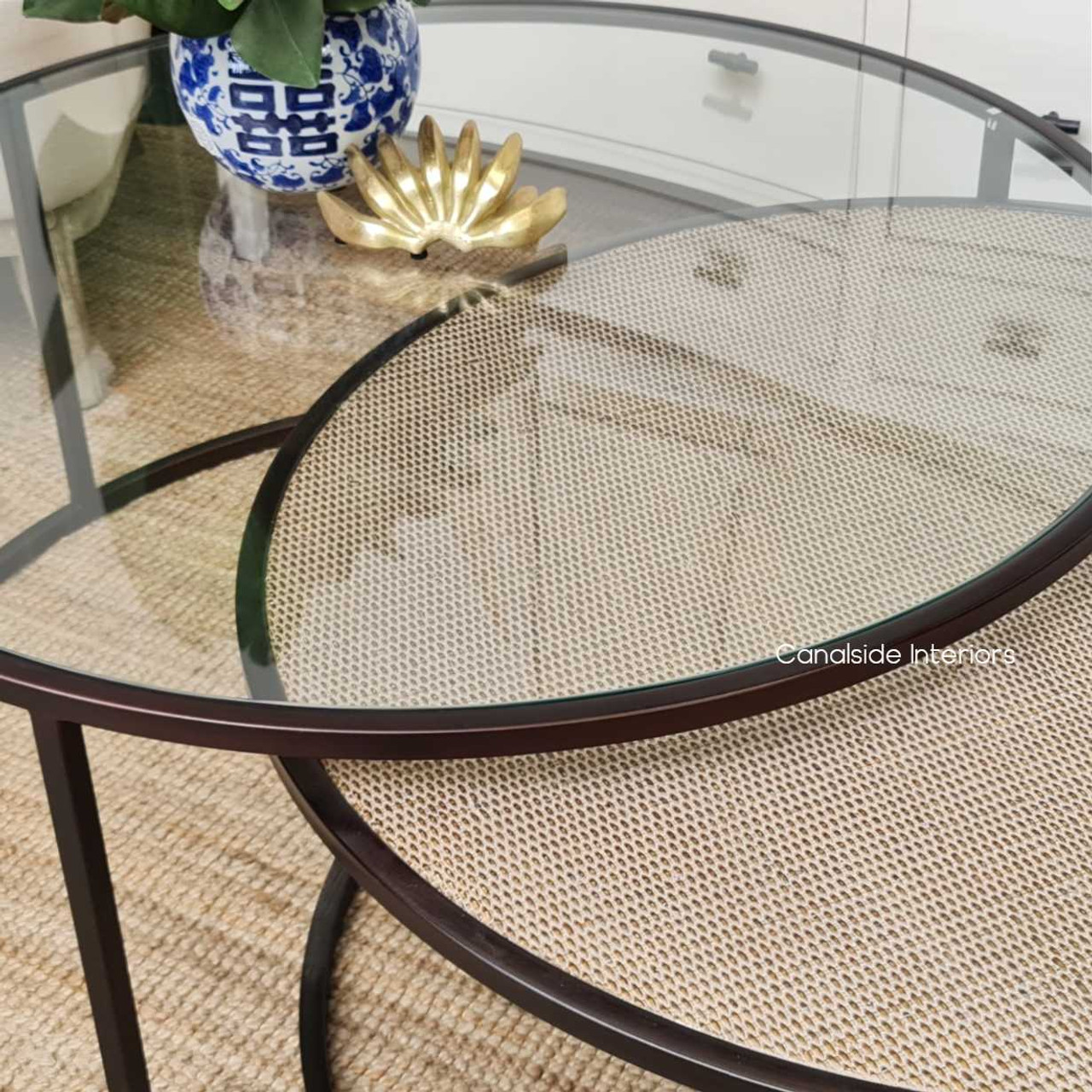 The Knox Coffee Tables from Canalside Interiors, featuring a distressed brass finish, embody modern craftsmanship with a traditional touch