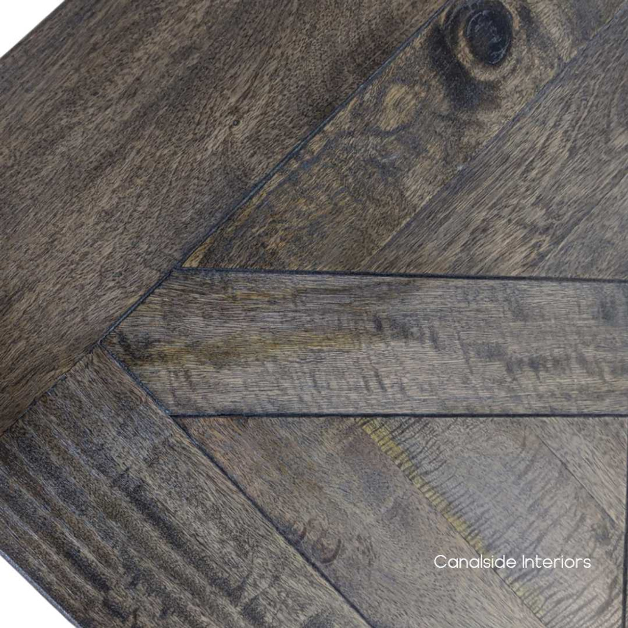 Close-up on the table's hand-crafted parquetry detailing, showcasing the exceptional craftsmanship and elegant design.