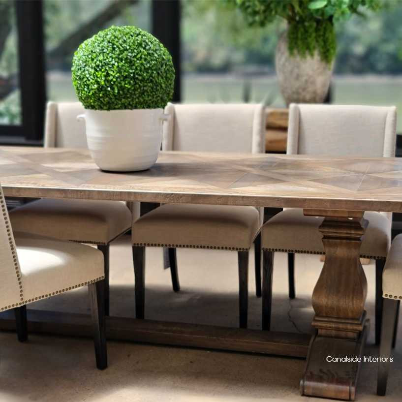 The Bridgehampton dining table featured in a luxurious Hamptons retreat, perfectly matching the serene and sophisticated decor.