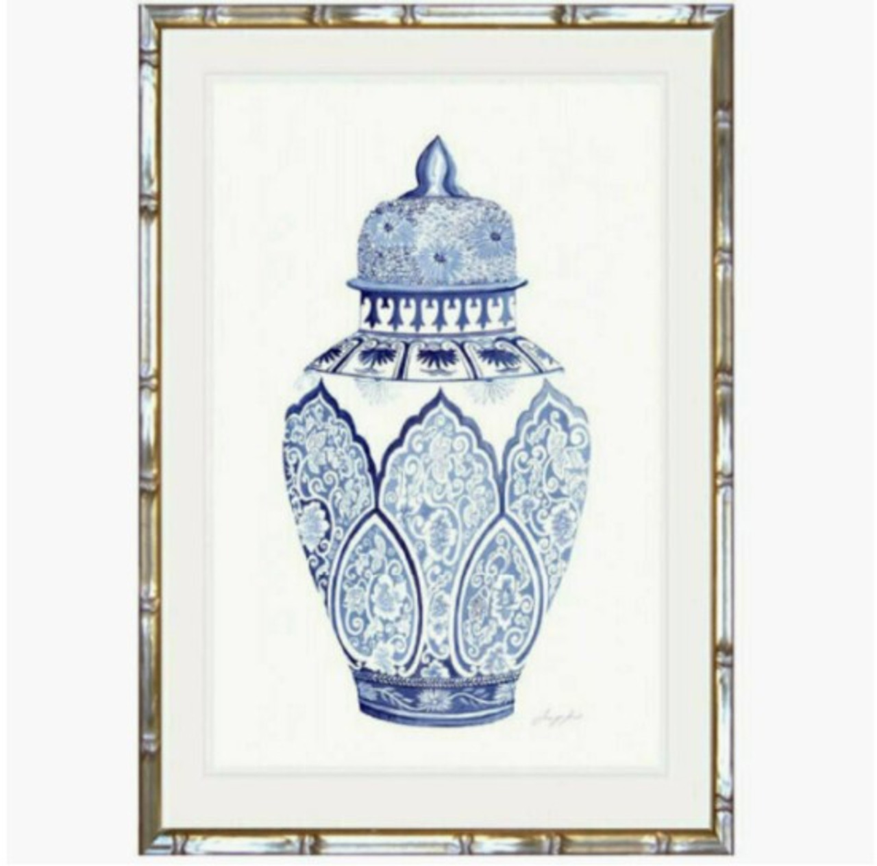 This Chinoiserie urn print by Jennifer Hunt, framed in champagne faux bamboo, is a sophisticated touch for any bedroom seeking Hamptons-style tranquility into your living room with a blue and white Chinoiserie urn print, offering timeless quality and coastal serenity - Canalside Interiors