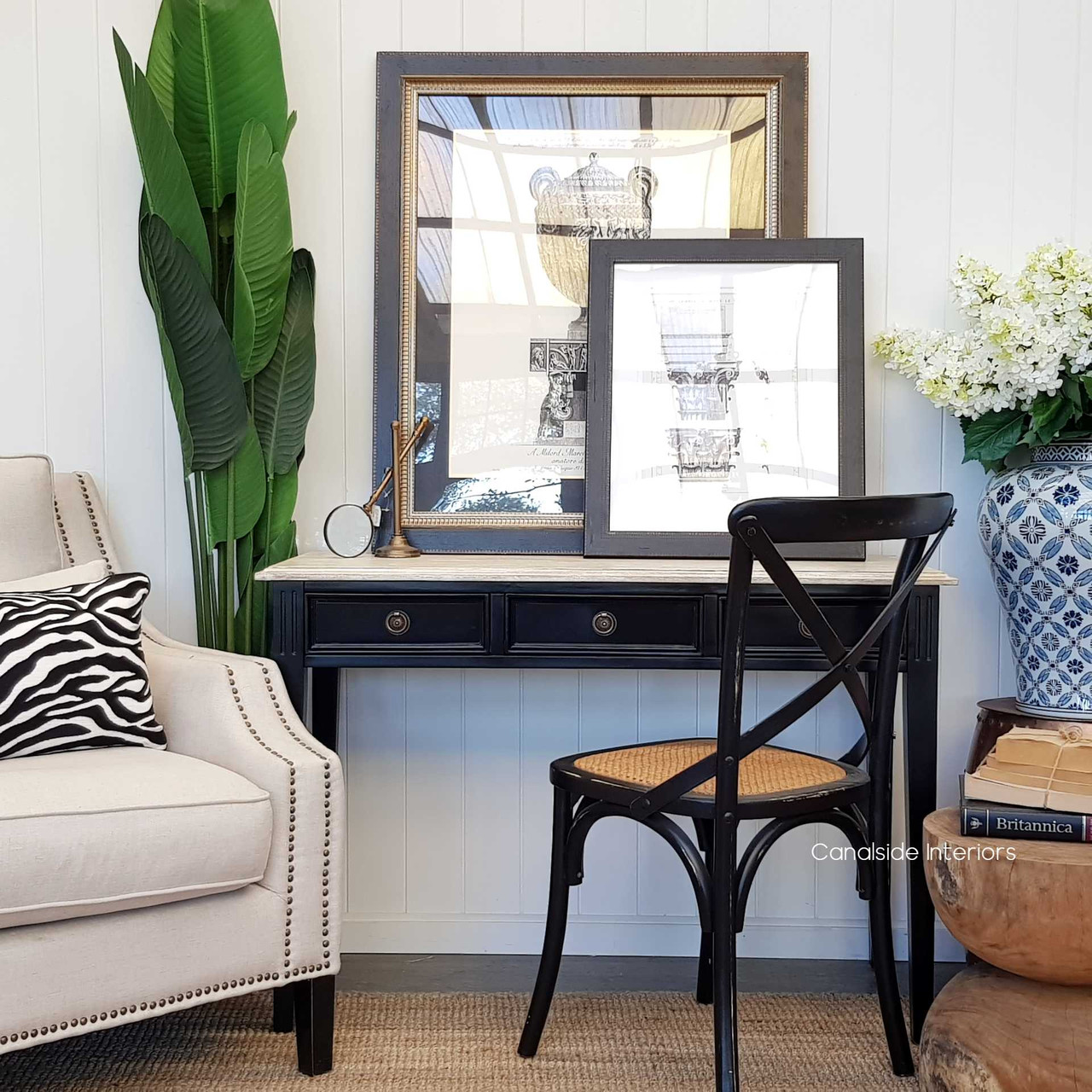 Lifestyle image depicting the desk/console in a coastal living room, serving as a chic console table against a serene backdrop,