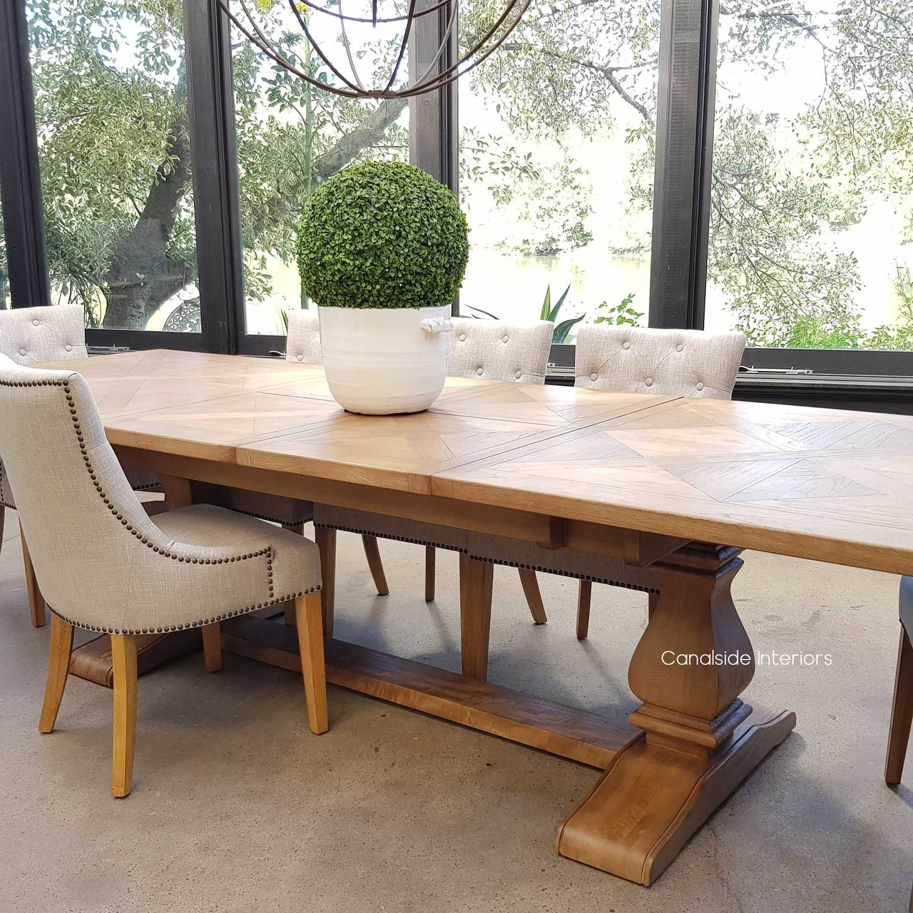 An atmospheric dining setup featuring the table fully extended, creating a warm and inviting space for guests and family.