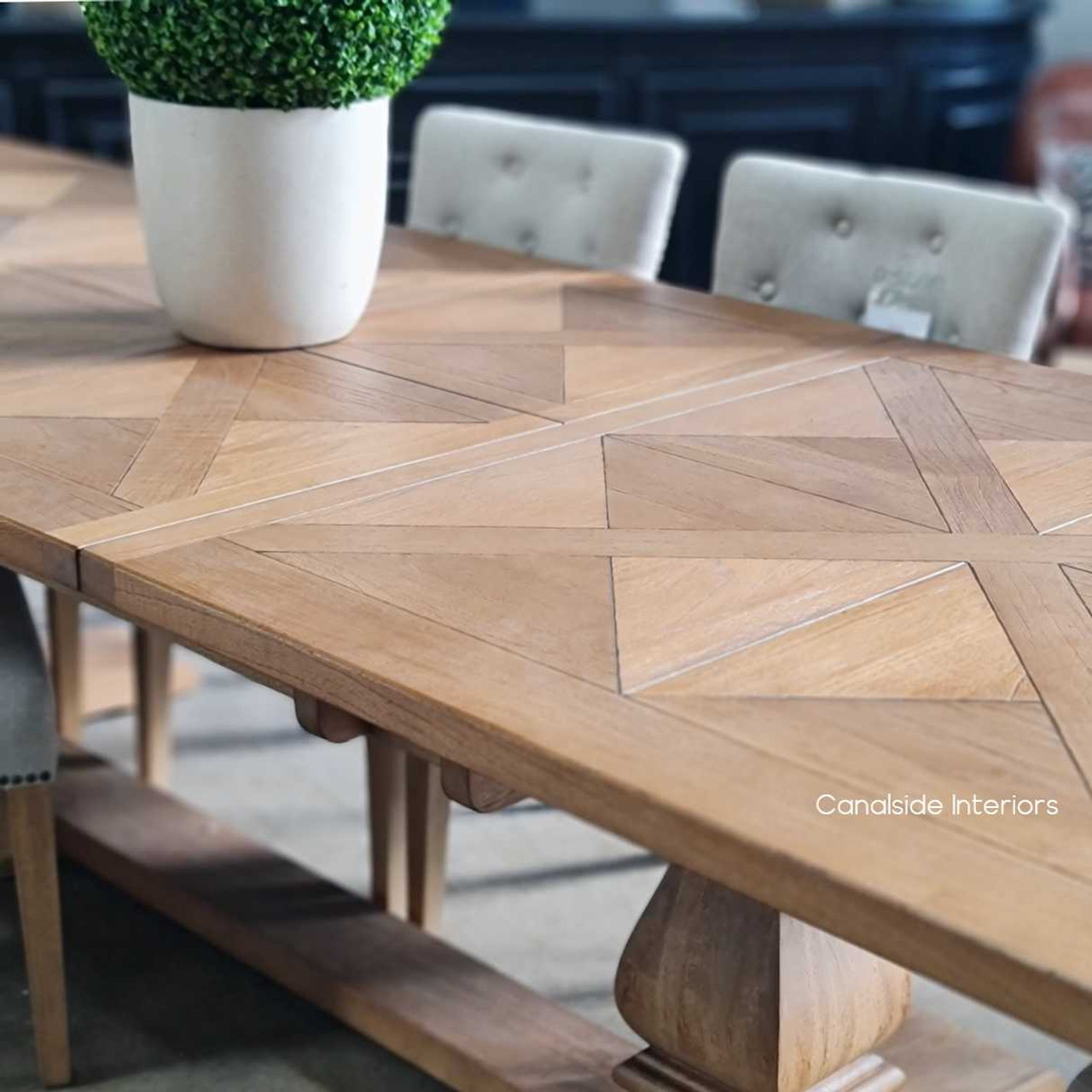 A detailed view focusing on the craftsmanship and textural yet smooth finish of the table, highlighting Canalside Interiors’ attention to detail.