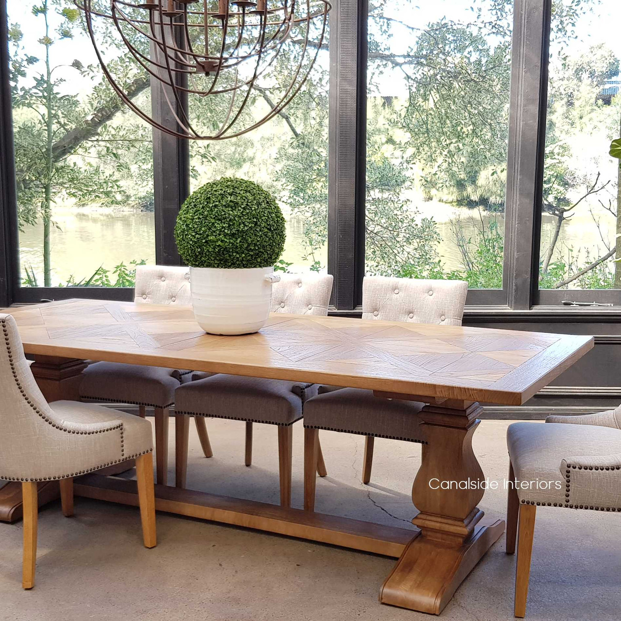 Elegant dining setup featuring the Hampton Bay Table, illustrating its spacious design and suitability for large family gatherings and sophisticated entertaining.