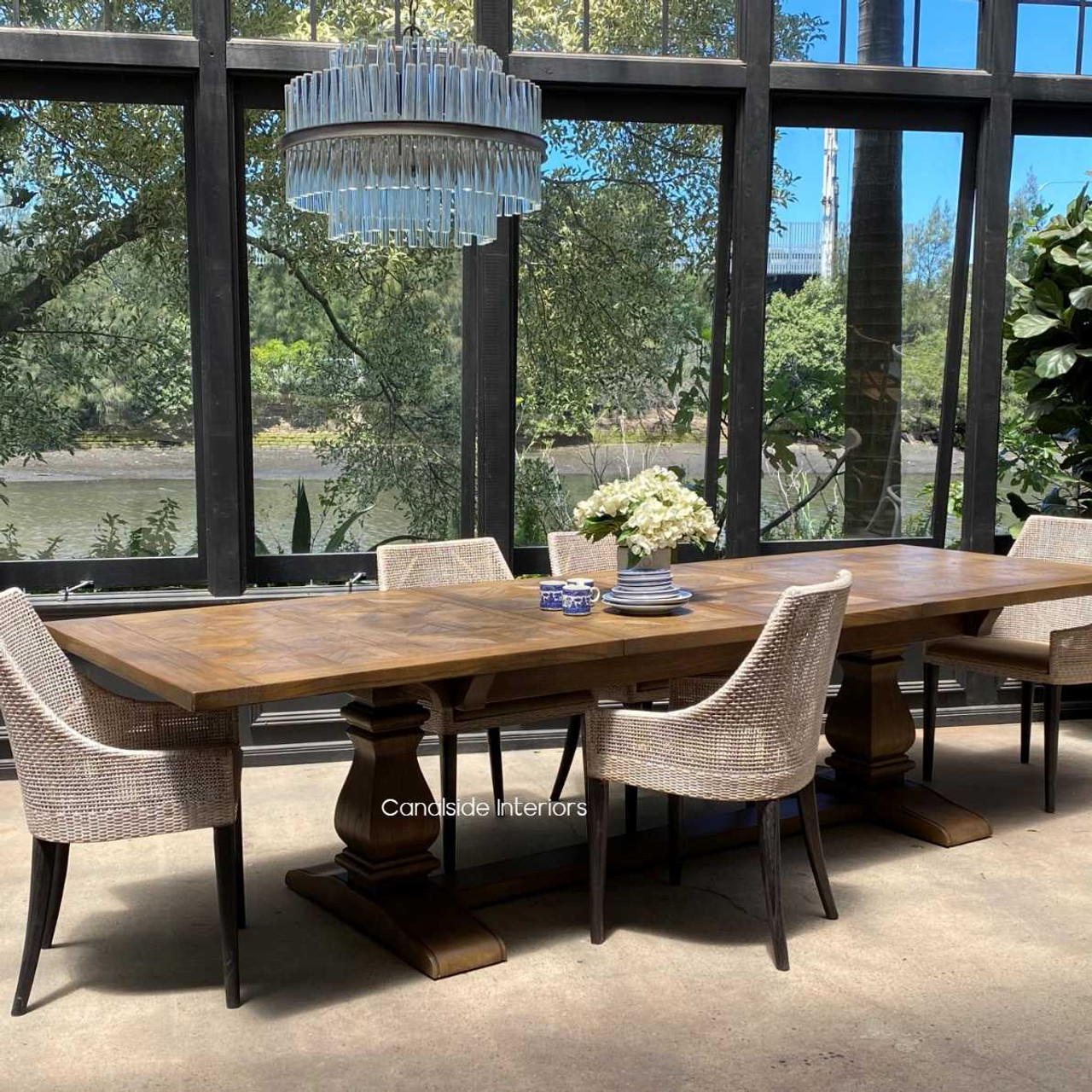 In a rustic farmhouse dining room, the table blends classic charm with functional elegance.