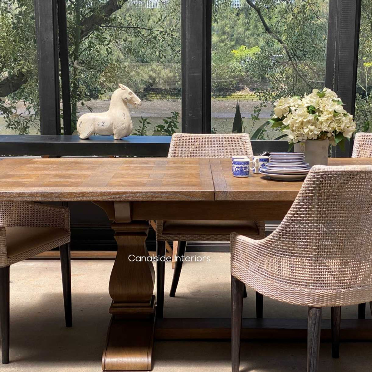 The table ready for a casual brunch, illustrating its suitability for various meal settings, from formal dinners to relaxed gatherings.