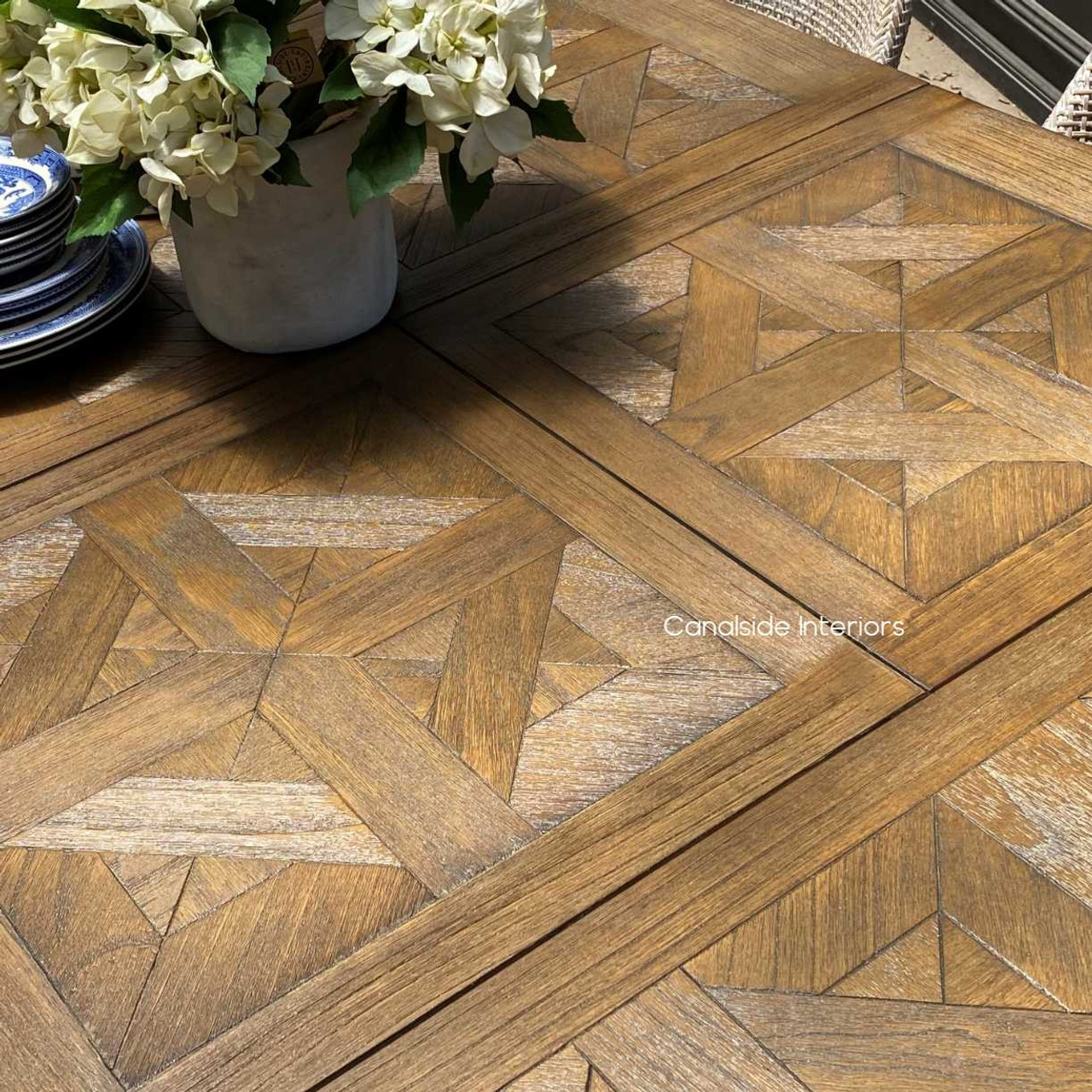 Close-up of the hand-crafted parquetry top, highlighting the meticulous detail and textural yet smooth finish.