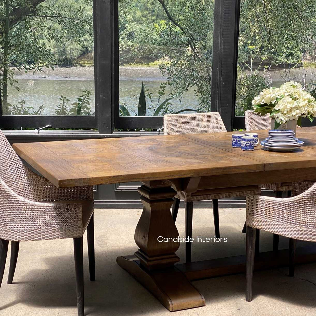 Full room view showcasing the Provence Parquetry Dining Table as the heart of a stylish, welcoming dining area.