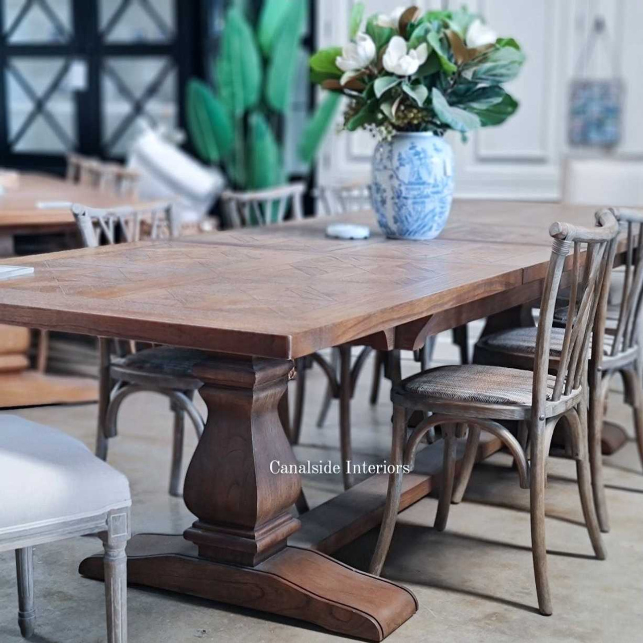 Styled within a Hamptons-inspired dining room, the table complements the coastal decor with its relaxed yet elegant aesthetic.