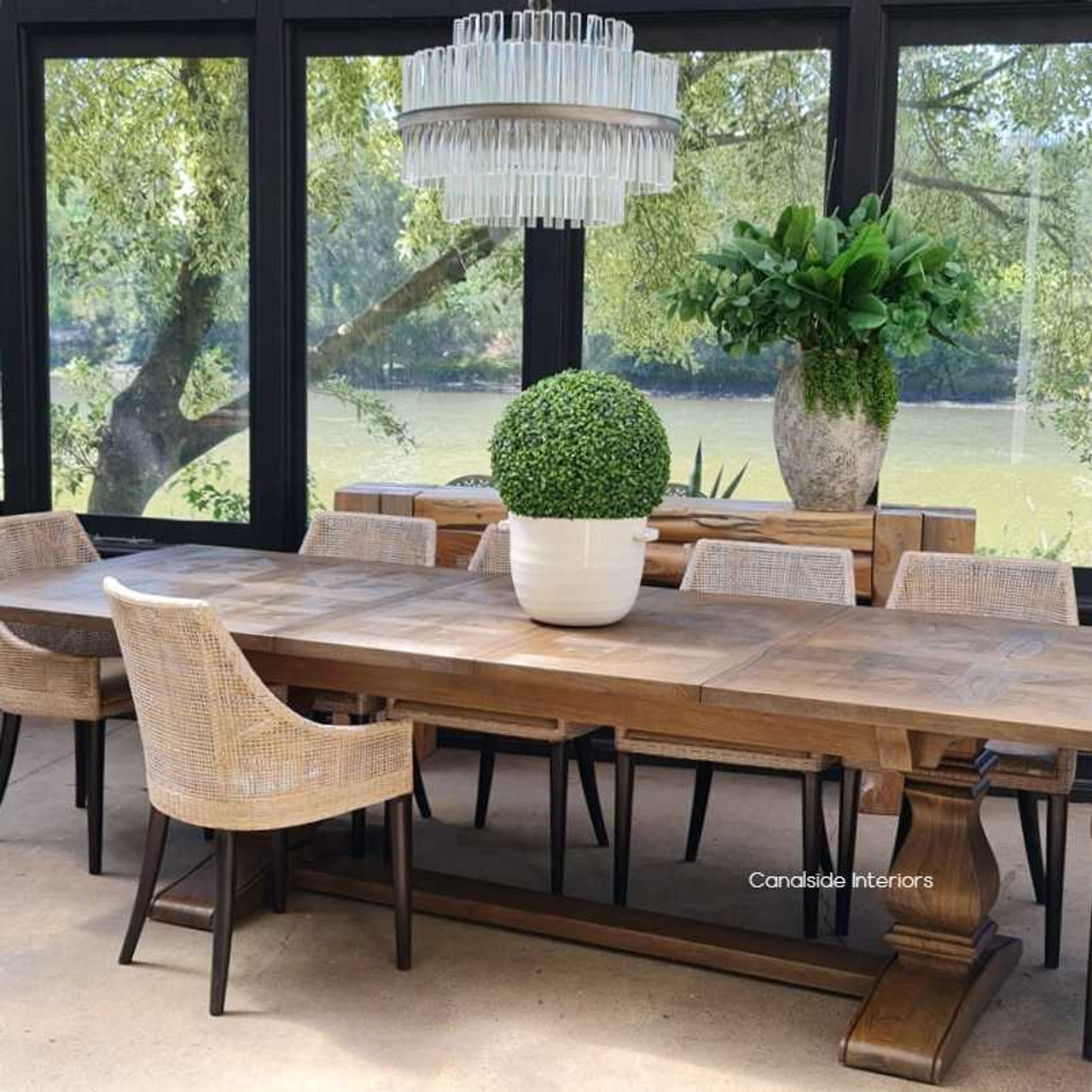 Lifestyle image of the dining table set for an intimate family meal in a Hamptons-inspired dining room.