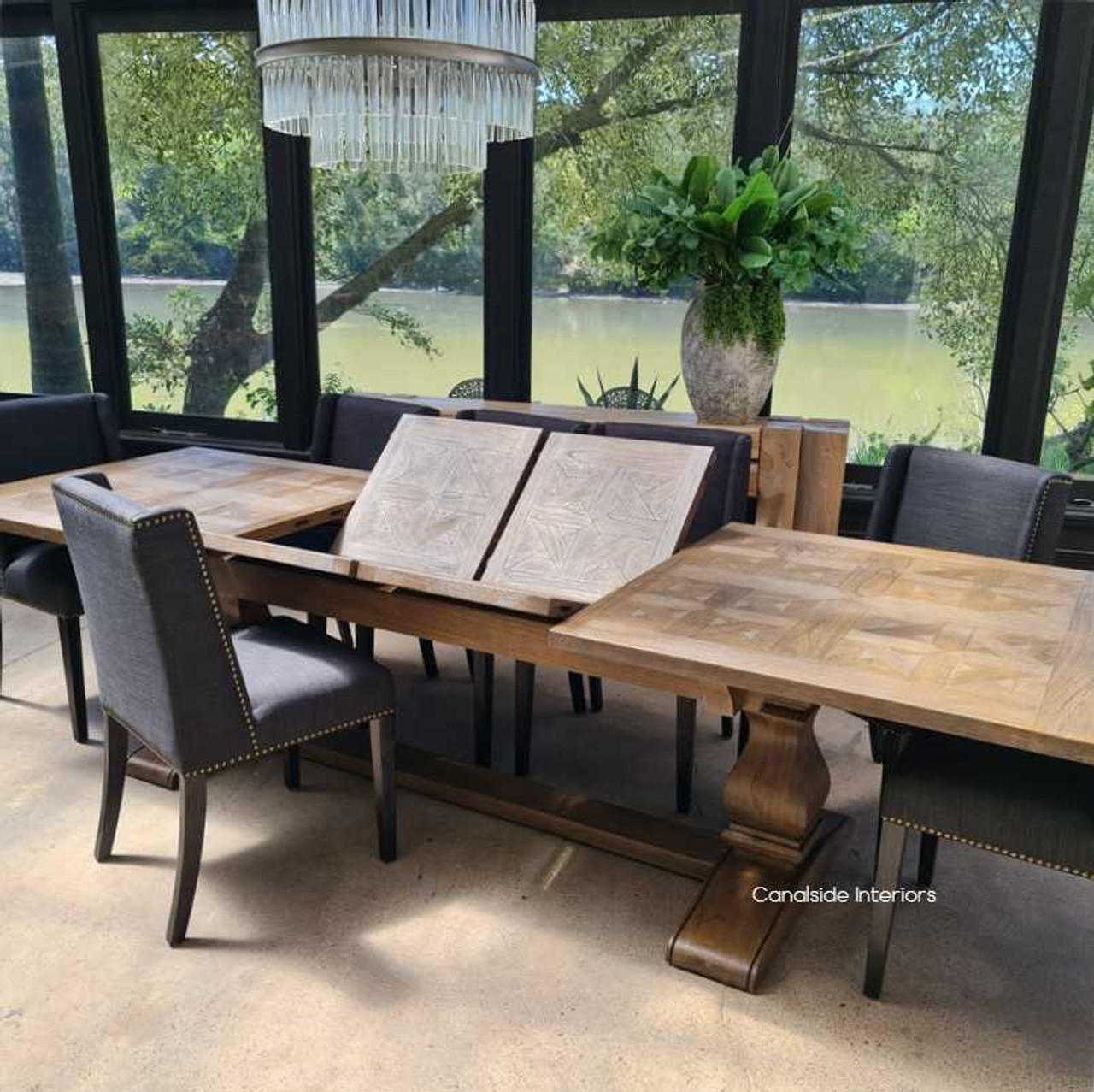 The table captured in a moment of transition from closed to extended, emphasizing the flexibility and functionality for growing families.