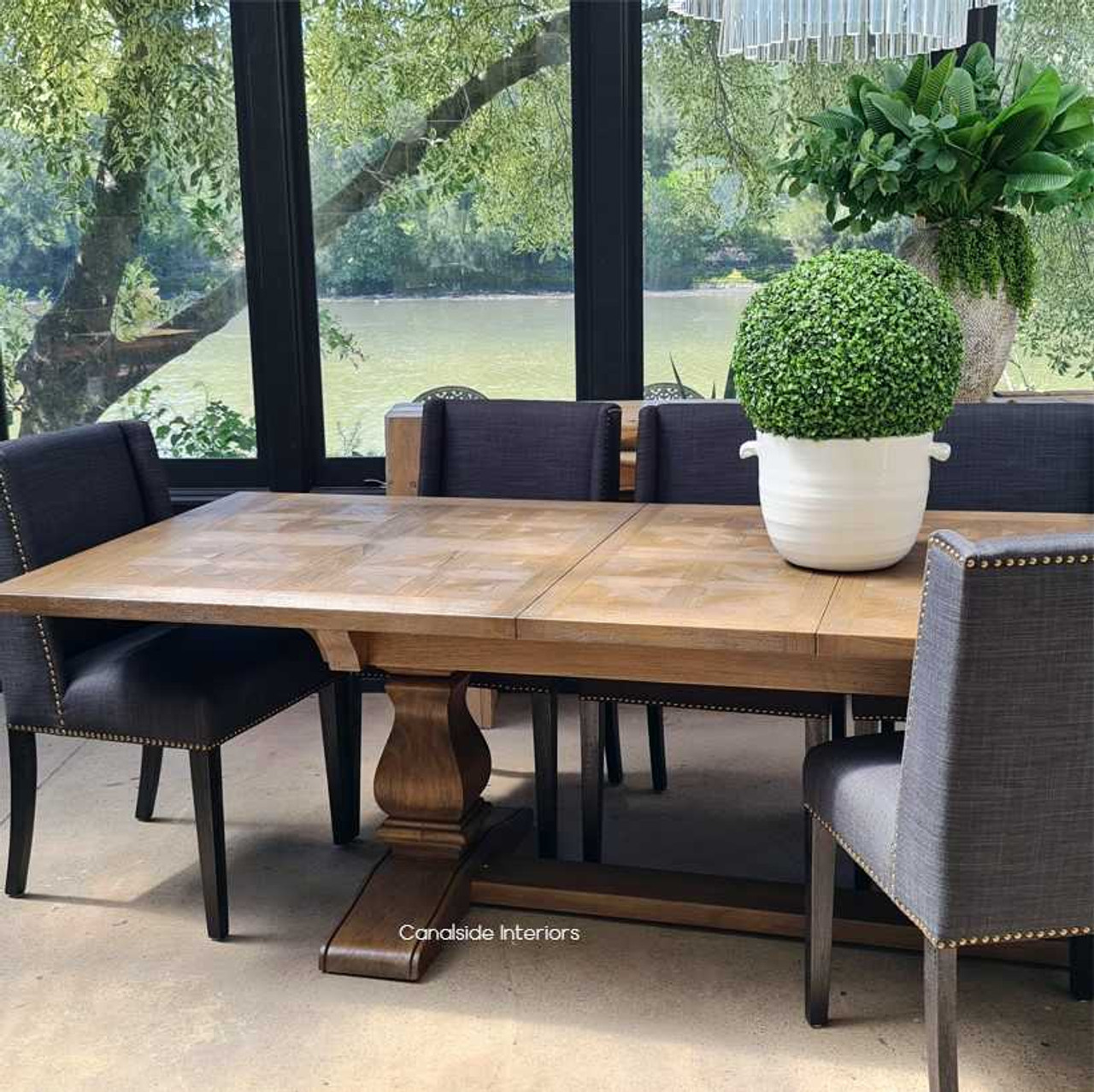 Arranged as the centerpiece in a sophisticated dining setting, ready to host a memorable dinner party.