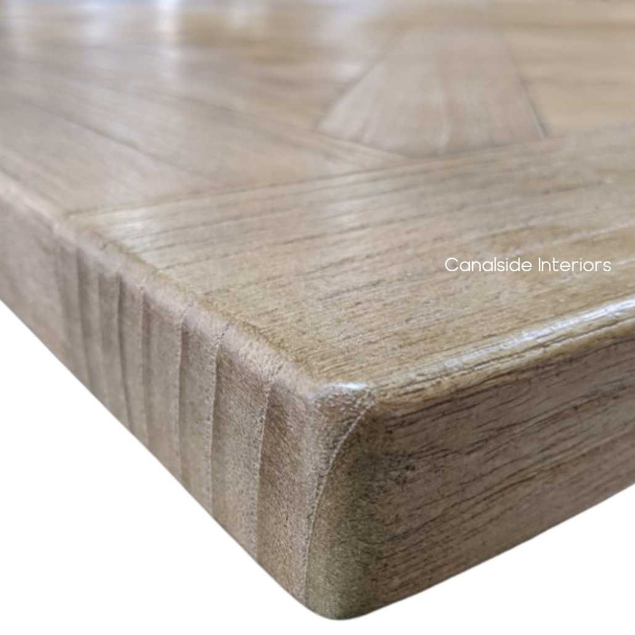 Close-up of the tableâ€™s edge, displaying the attention to detail in the parquetry work and the natural beauty of the White Cedar wood.