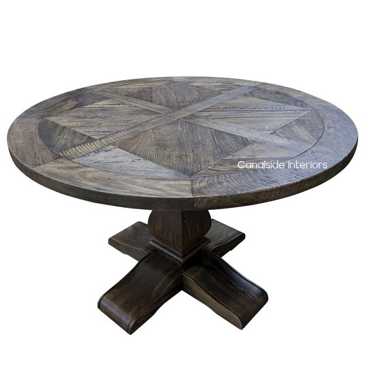 The Bridgehampton Round table captured in a well-lit dining area, showcasing its reflective quality and the timeless design that suits any home style, from Hamptons to contemporary.