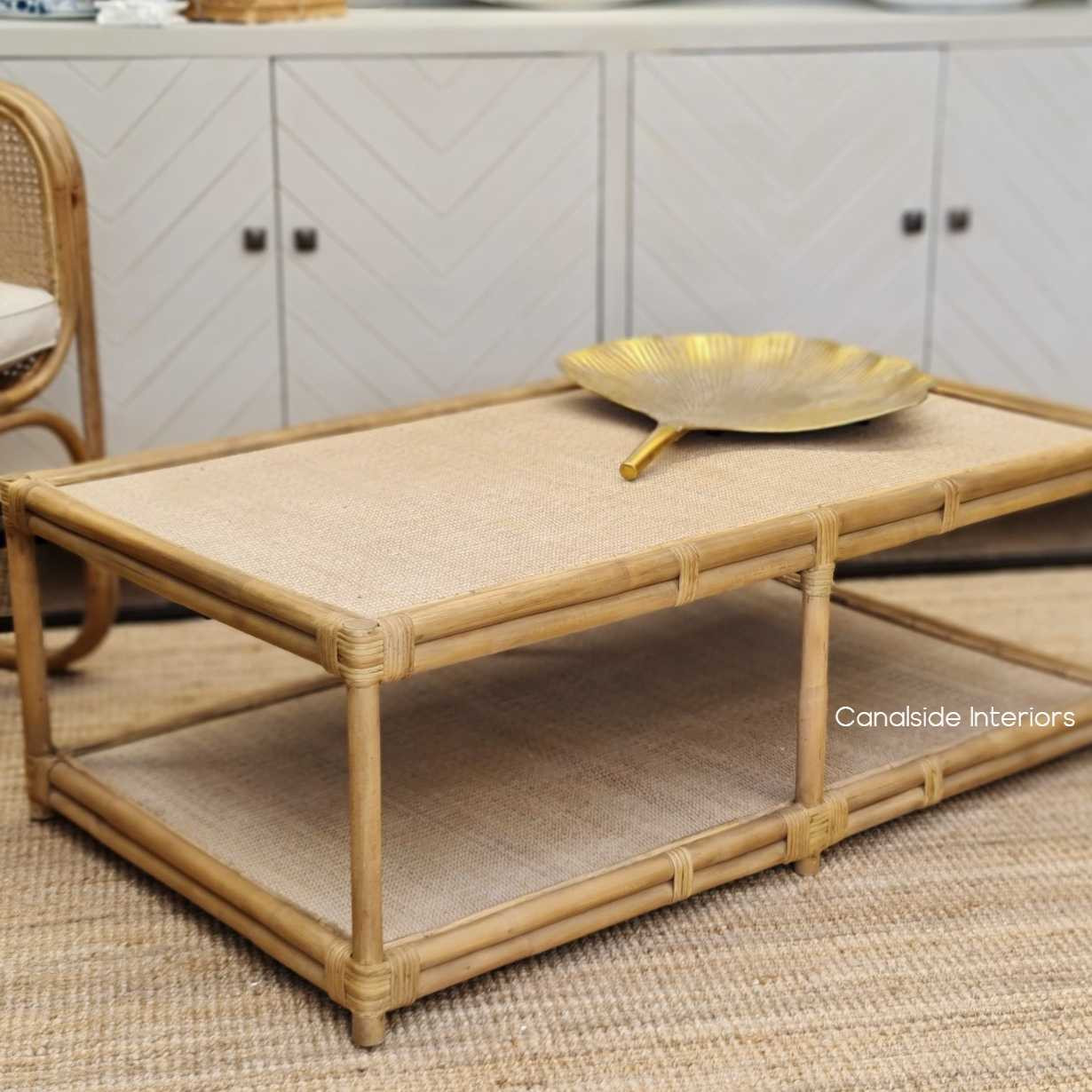 A perfect addition to a coastal living room, the Raffles Rattan Table epitomizes Canalside Interiors' commitment to timeless, quality furniture.