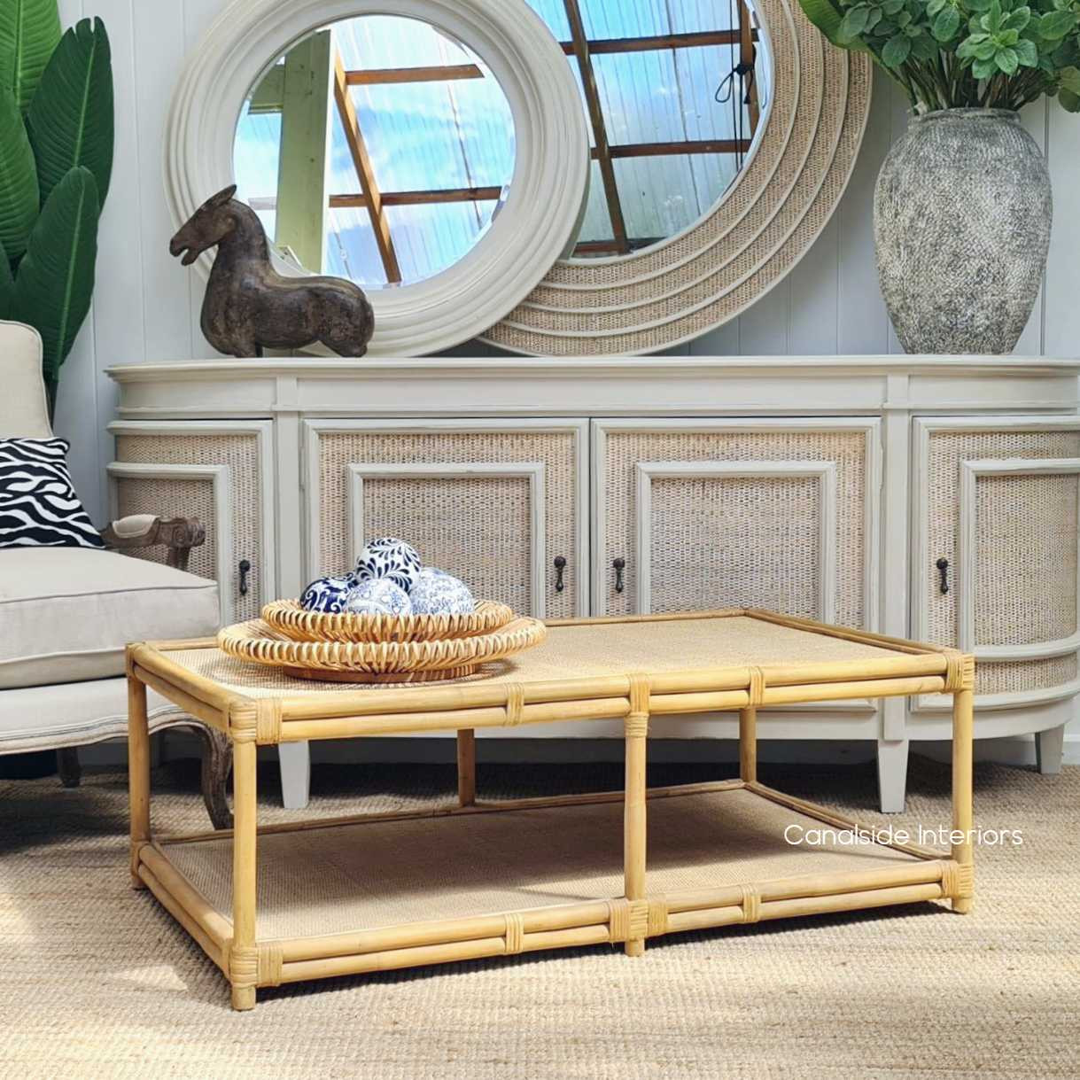 Transform your lounge area with this eco-friendly rattan and cane table, celebrating quality and sustainable design - Canalside Interiors.