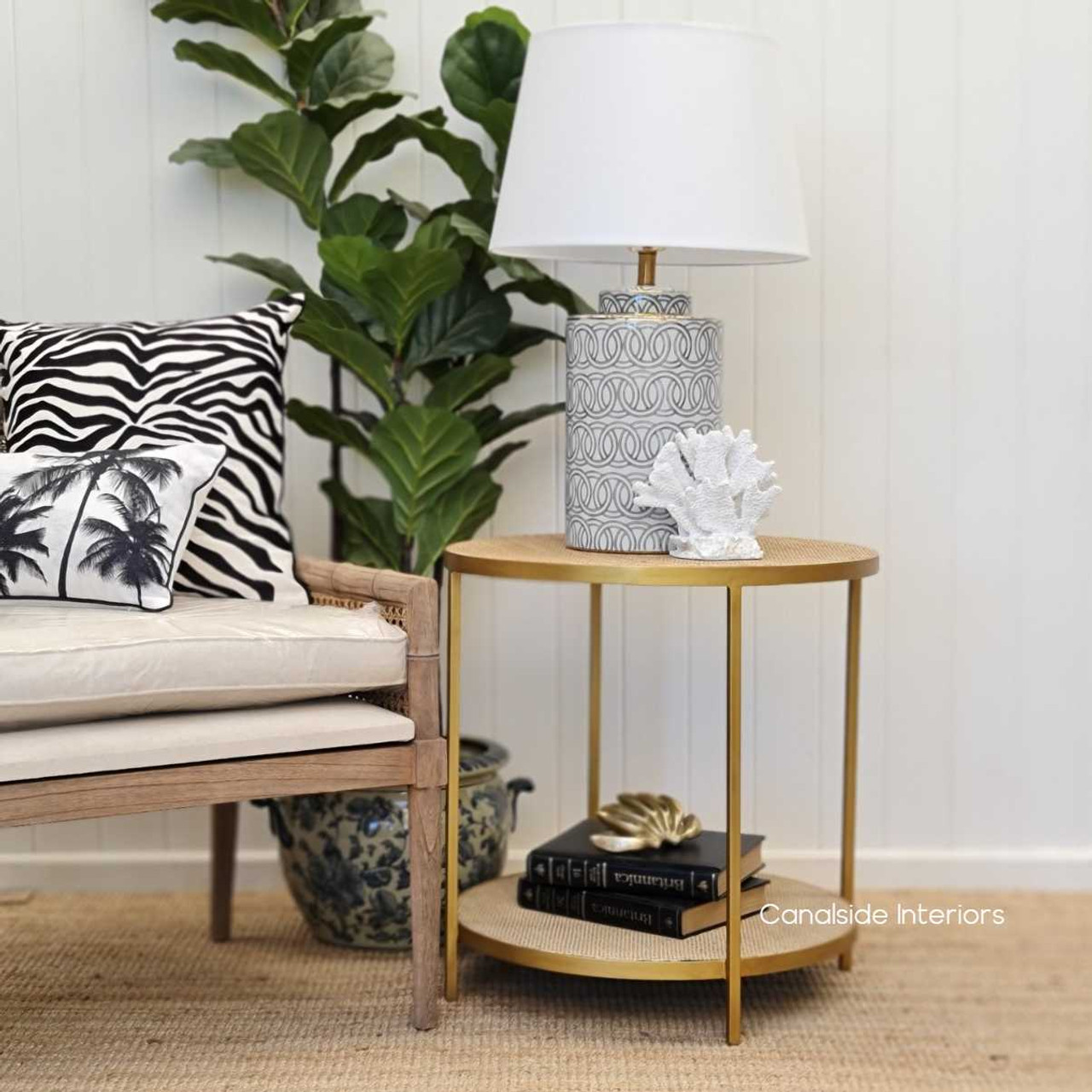 Add a glamorous Chinoiserie touch to your bedroom with the gold-framed Knox Rattan Side Table, reflecting quality and style
