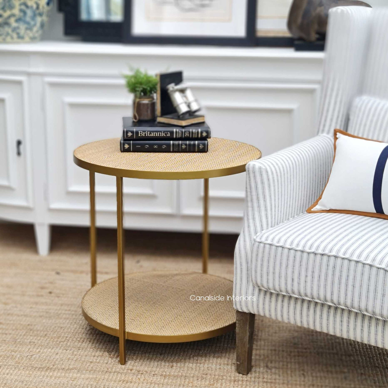 Accentuate your Hamptons-style home with the chic Knox Rattan Side Table, showcasing a contemporary gold frame for an instant glam update