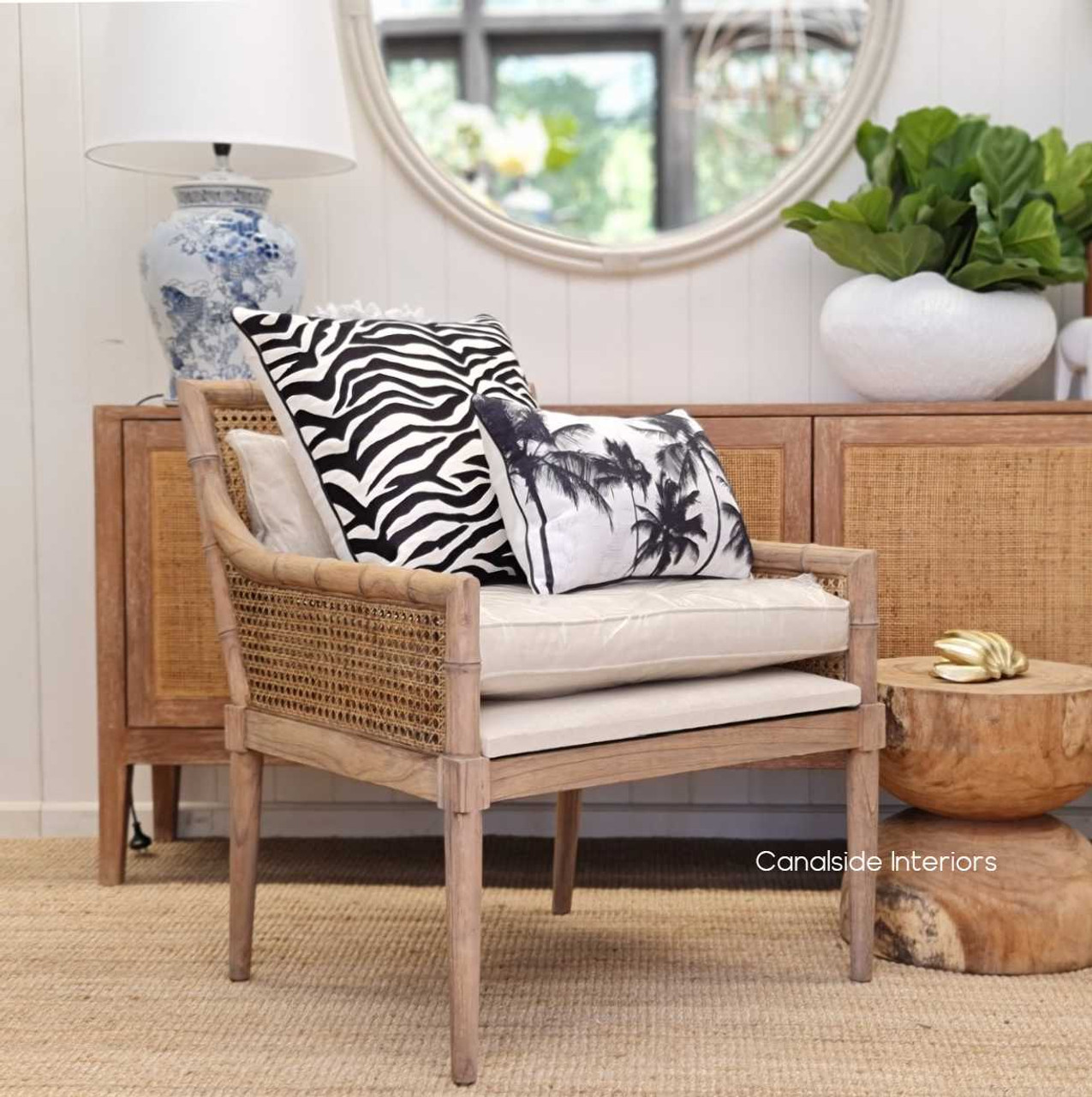 Angle shot capturing the plush cream seat and back cushion of the Palmer Plantation Armchair, offering comfort and style in a living room setting.