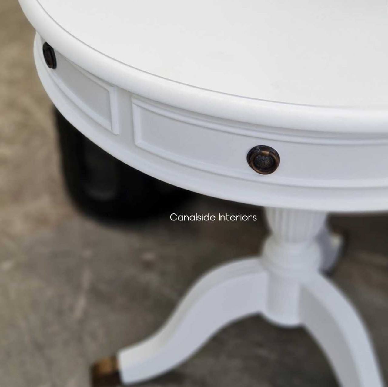 Canalside Interiors presents the elegant Cobble Hill Large Round Table in white, making a statement in your dining room with its refined and coastal-inspired design.