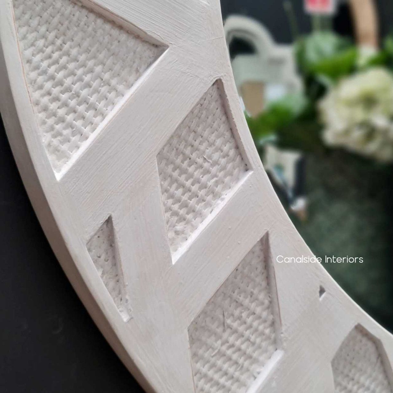 Detail shot of the distressed stone finish, emphasizing the mirror's casual yet classic appeal and on-trend Chinoiserie elegance.