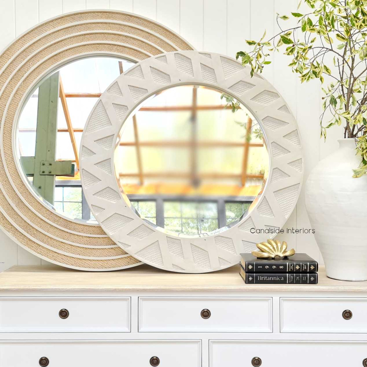 The Botanica Rattan Mirror amidst contemporary decor, showcasing its ability to complement modern interiors with its chic design.