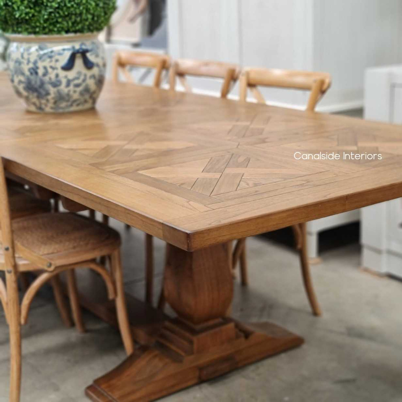 Chic and sturdy, the Stamford Parquetry Dining Table's white cedar craftsmanship brings a cozy yet luxurious feel to your Hamptons-style home office