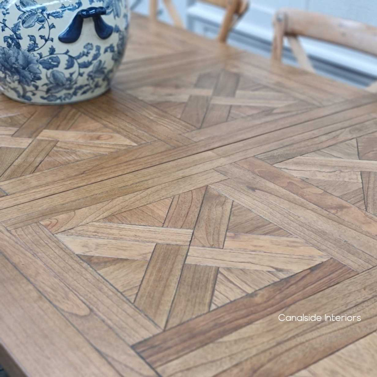 Expandable white cedar Stamford table with artful parquetry, a luxurious centerpiece for coastal-themed living rooms or open-plan spaces