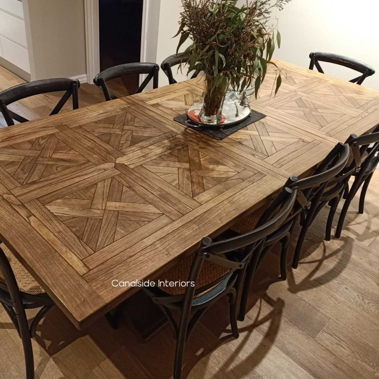 Stamford table with a pedestal base and detailed carvings, a durable yet stylish choice for a coastal bedroom or home library