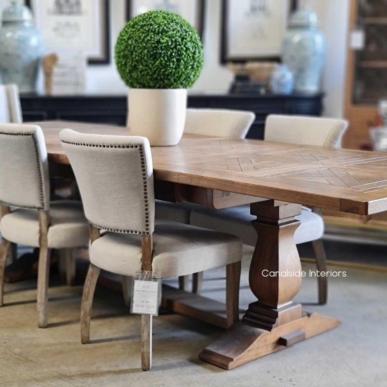 Timeless Stamford extension table with a hand-crafted trestle base, seamlessly transitions from intimate family meals to large gatherings, ideal for the modern home