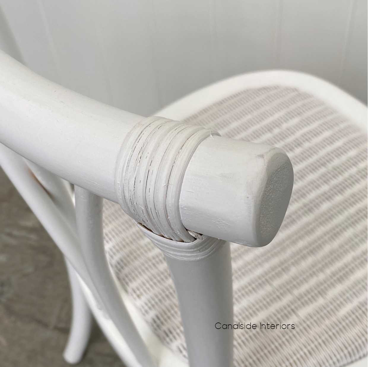 Detail shot of the chair's patina finish, emphasizing the beauty and quality of the oak timber and its easy-to-clean surface.