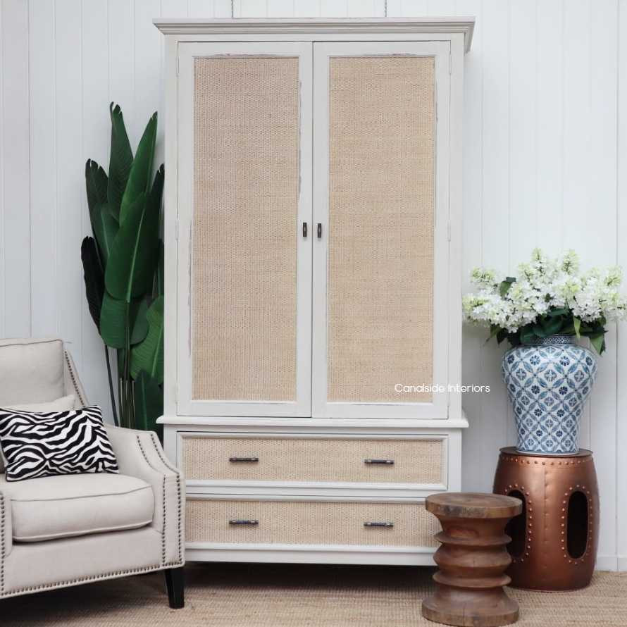 Front view of the Brielle Rattan Wardrobe Cupboard in distressed stone, highlighting the natural rattan details and elegant design.
