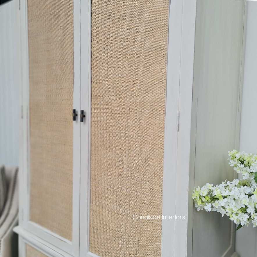 Close-up on the natural rattan work, showcasing the fine craftsmanship and texture that adds a coastal charm to the piece.