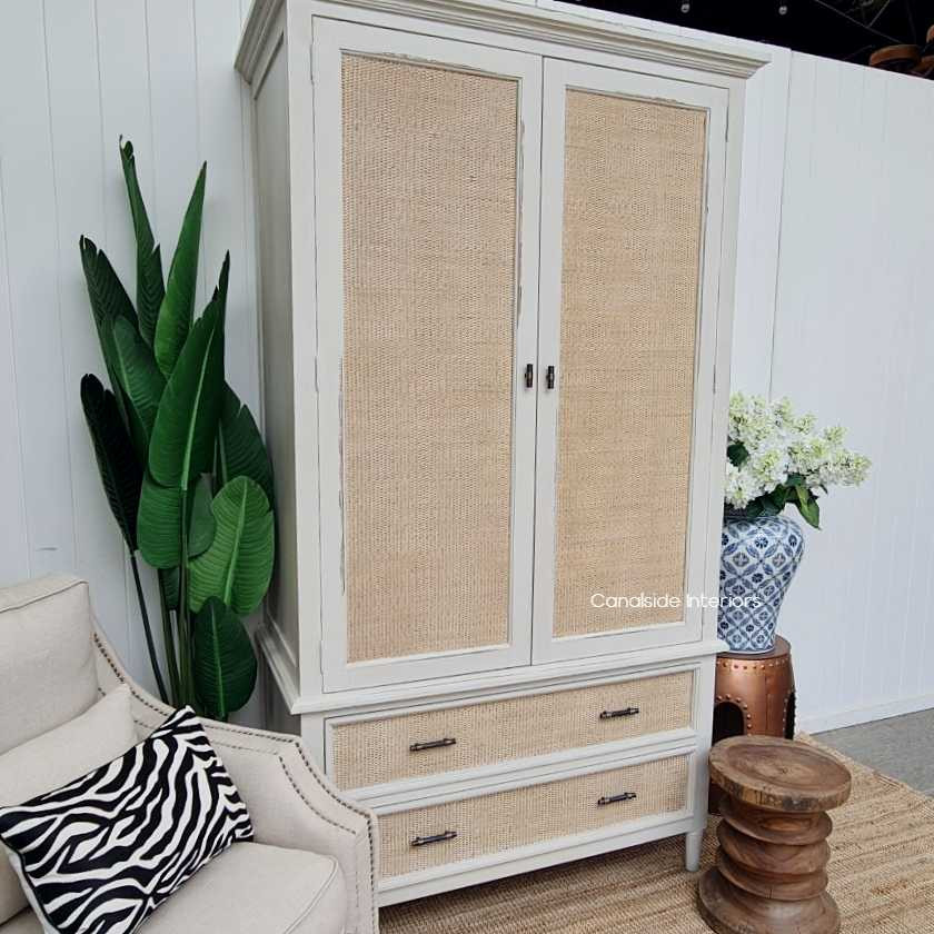 Angled perspective capturing the wardrobe's overall stature, ideal for bringing a statement of natural elegance to any room.