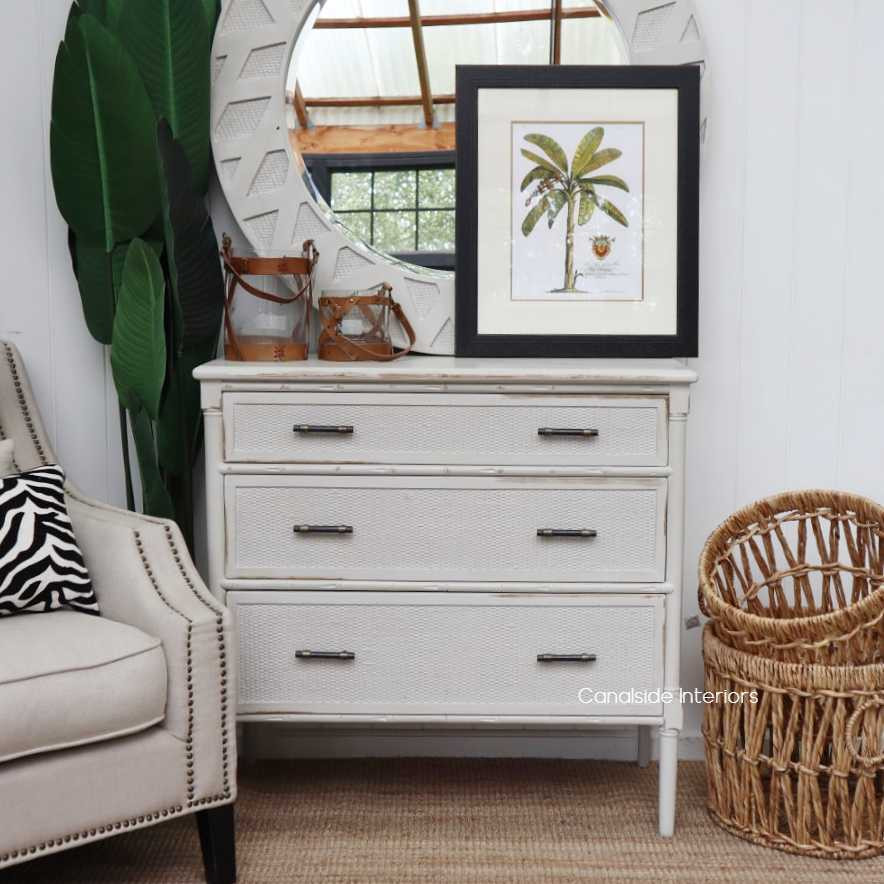 The Stone Brielle Rattan Chest, with its three generously sized drawers, is an ideal storage solution for a modern home office with a touch of coastal elegance