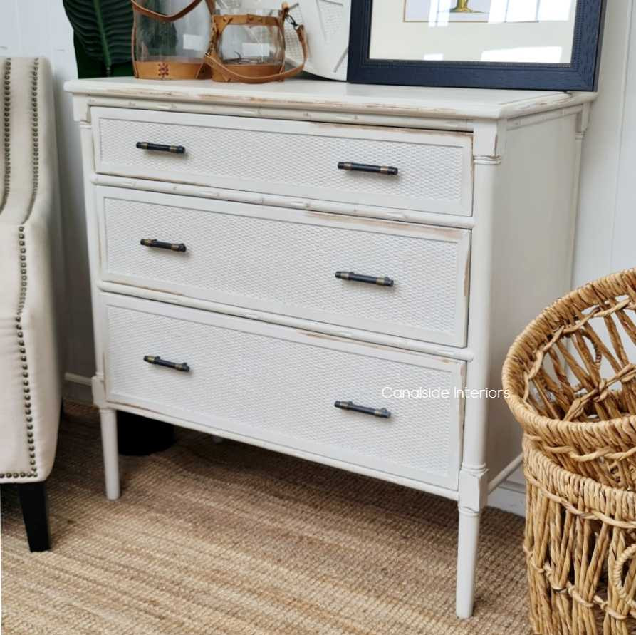 Side perspective of the Brielle Rattan Chest shows off its robust frame and the depth of the rattan weave, a perfect storage addition to any Hamptons-style dining room - Canalside Interior