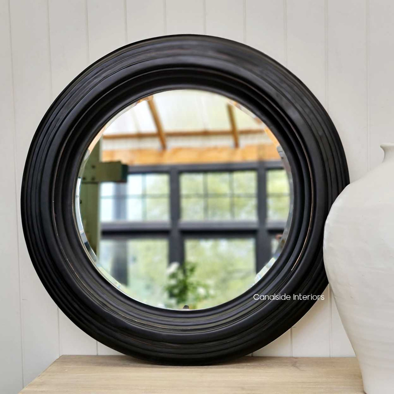 The Aspen mirror captured in a well-lit area, showcasing its reflective quality and the timeless design that suits any home style.