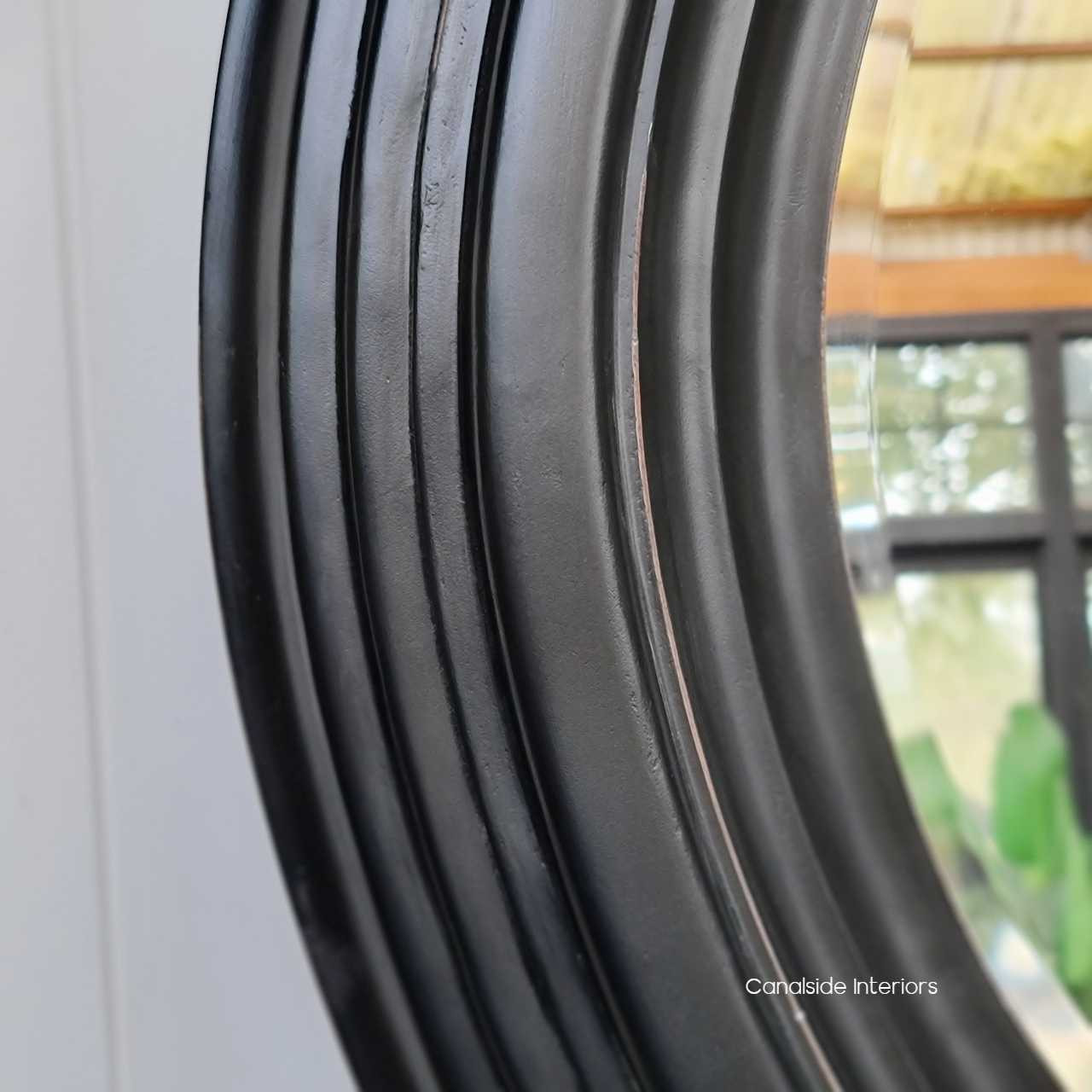 Close-up of the Aspen Mirror's frame, reflecting the attention to detail and high-quality materials used in its design.