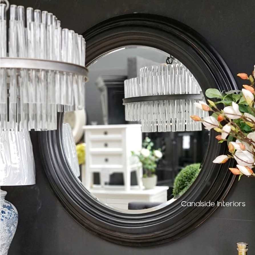 Angled shot illustrating how the Aspen Mirror complements a classical interior, adding a layer of richness and depth.