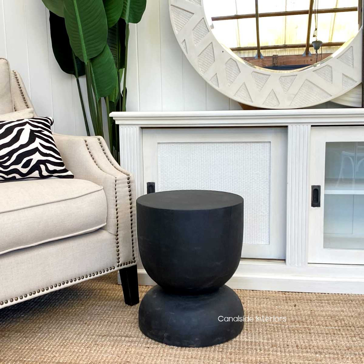 Distressed black Santorini Natural Wood Stool, perfect as a timeless accent piece for coastal-themed living rooms - Canalside Interiors