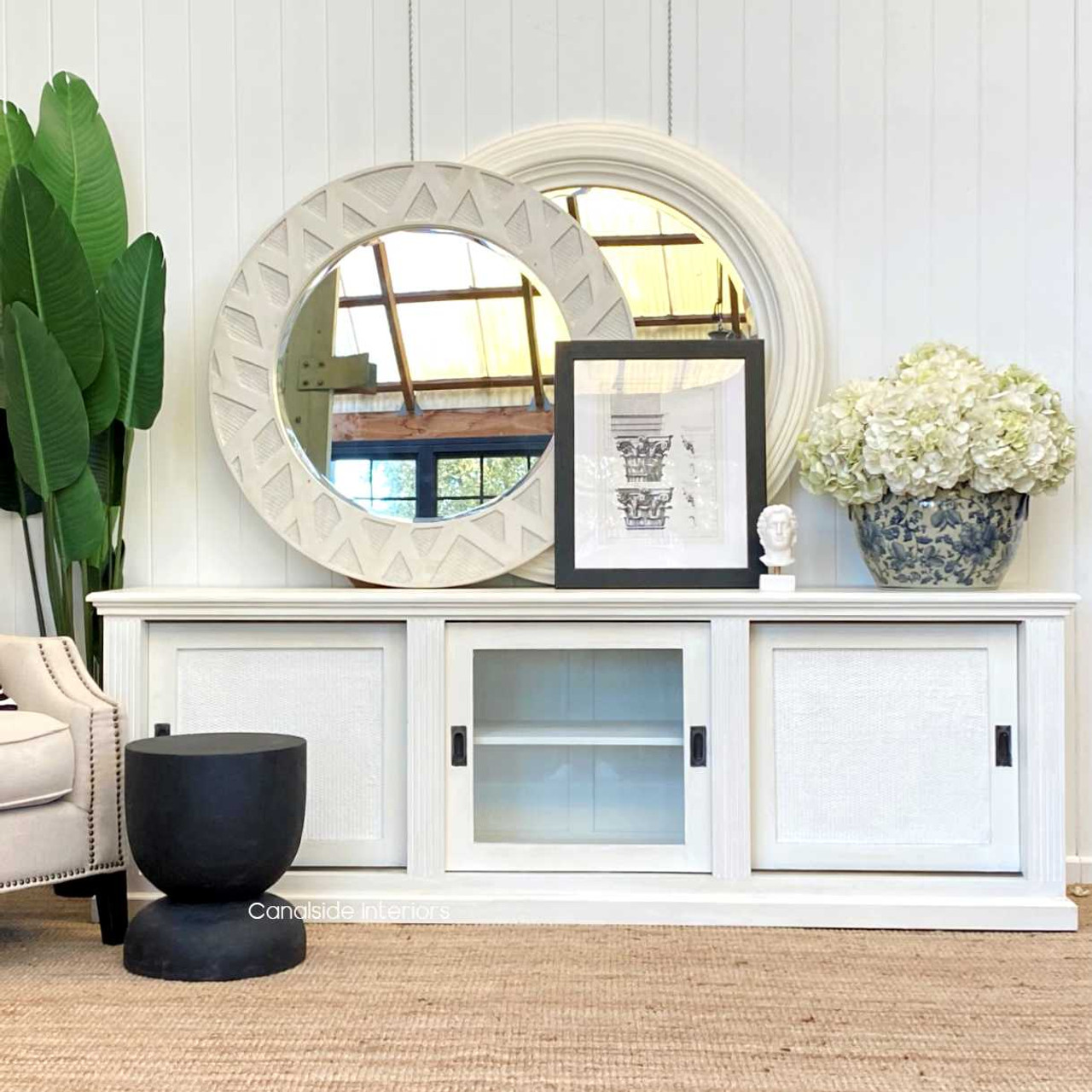 Hand-carved Santorini Stool/Side Table in distressed black, embodying a modern twist on classical Hamptons style - Canalside Interiors
