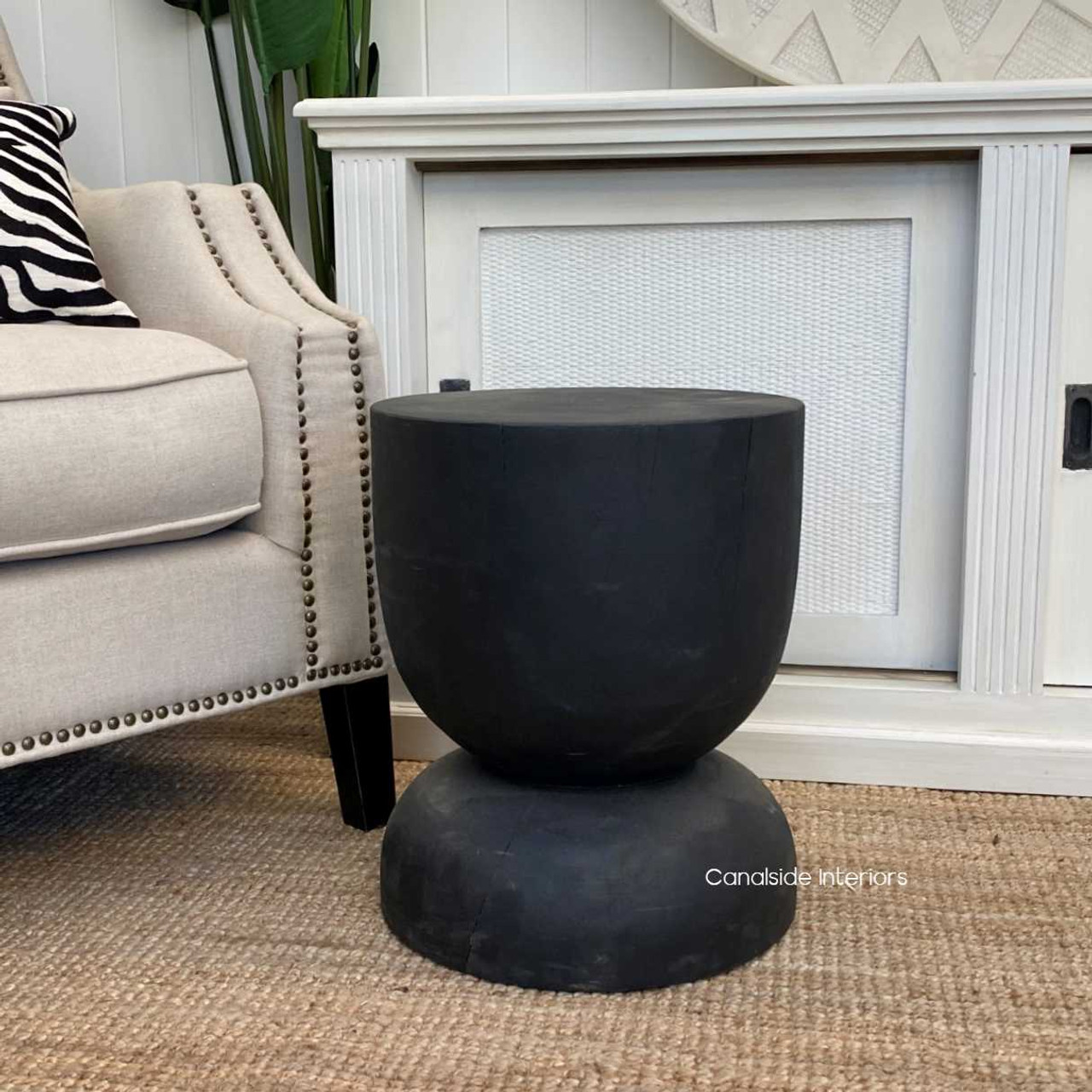 Artisan-crafted natural wood stool in distressed black, blending seamlessly with both classical and modern dining decors