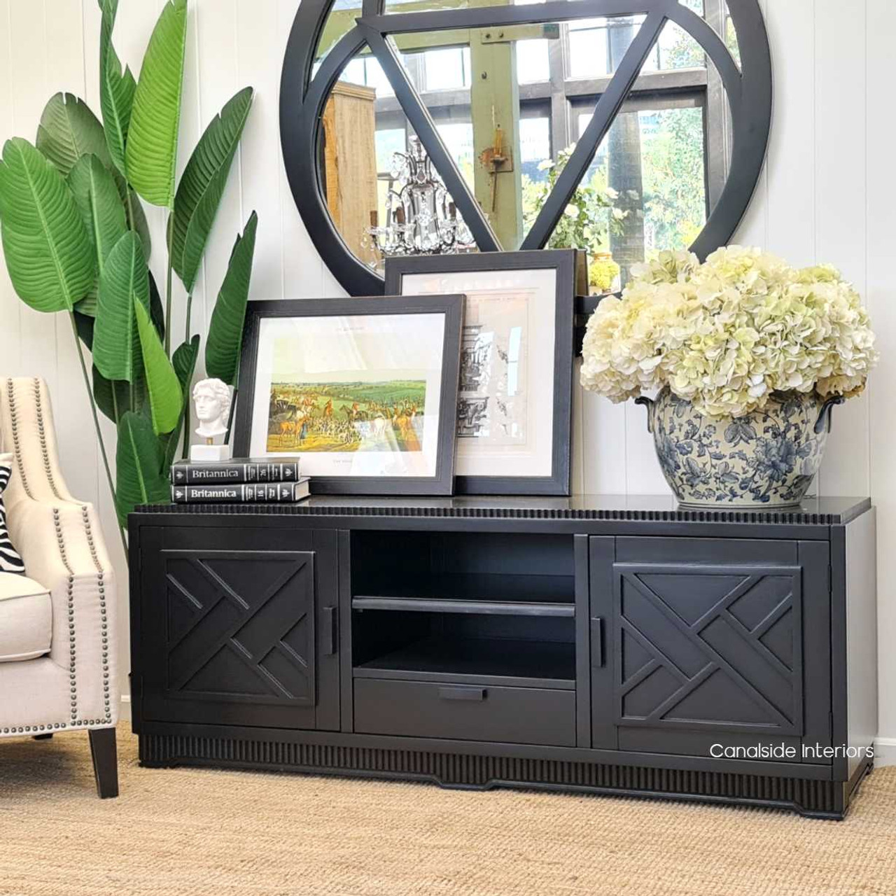 Sophisticated black TV stand hand-crafted with minor distressing, echoing Hamptons style for elegant lounges